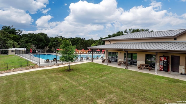 view of yard with a patio area and a community pool