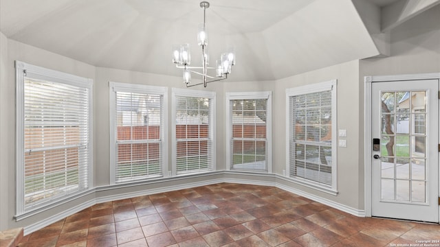 unfurnished dining area with lofted ceiling and an inviting chandelier