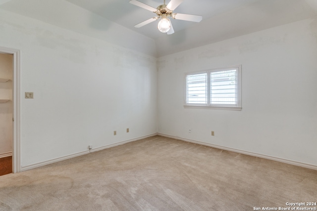 carpeted empty room with ceiling fan