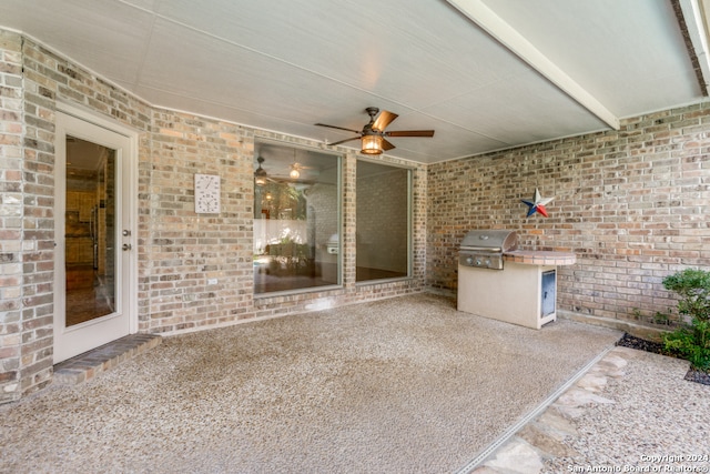 view of patio / terrace with an outdoor kitchen and a grill