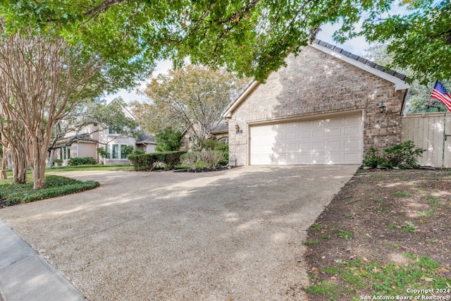 view of side of property with a garage