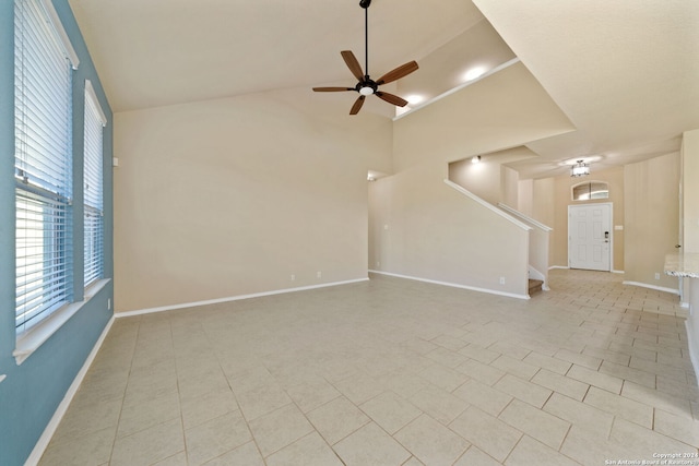 unfurnished living room featuring ceiling fan and light tile patterned floors