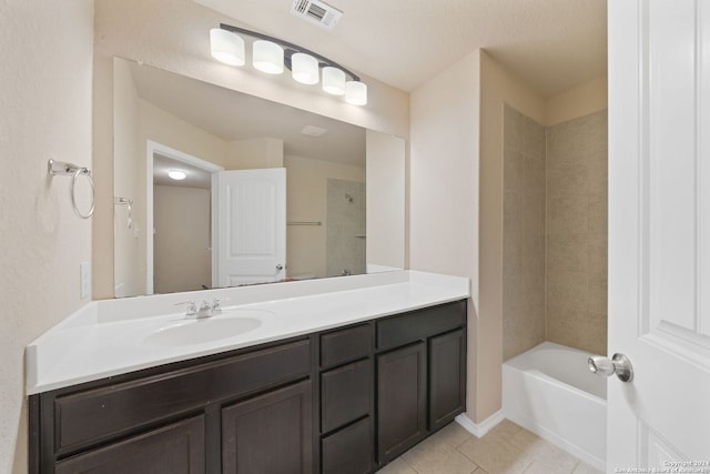 bathroom with tile patterned flooring and vanity