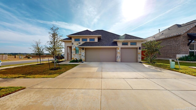 view of front of home featuring a garage and a front yard