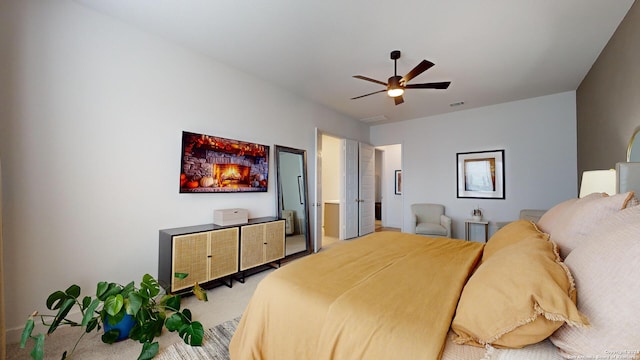 carpeted bedroom with ceiling fan