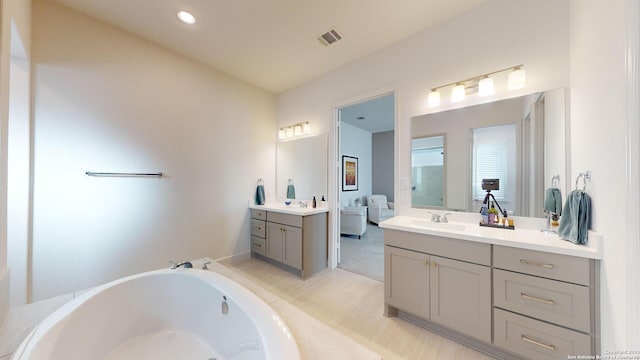 bathroom featuring tile patterned floors and vanity