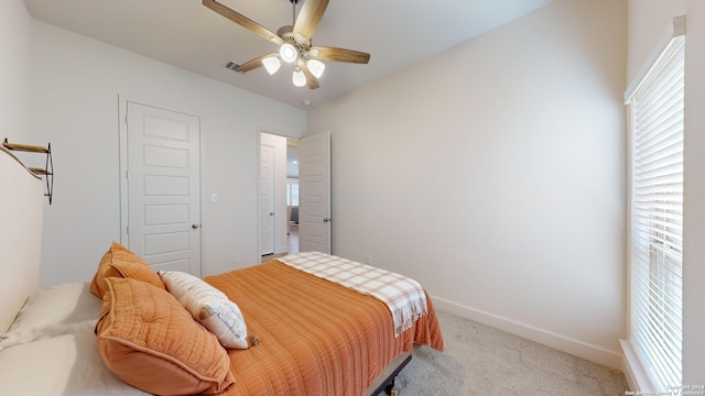 carpeted bedroom featuring ceiling fan