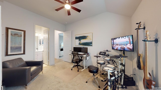 office space with light colored carpet, ceiling fan, and lofted ceiling