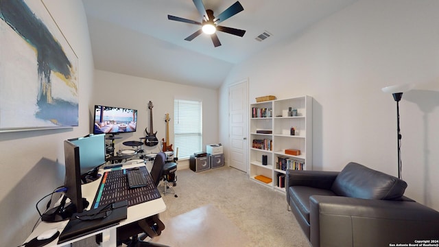 home office featuring ceiling fan, light colored carpet, and lofted ceiling