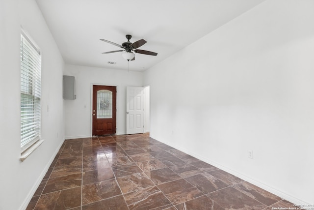 foyer entrance featuring ceiling fan