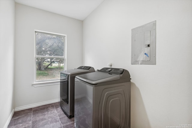 clothes washing area with electric panel and washer and clothes dryer