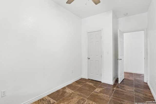 unfurnished bedroom featuring ceiling fan