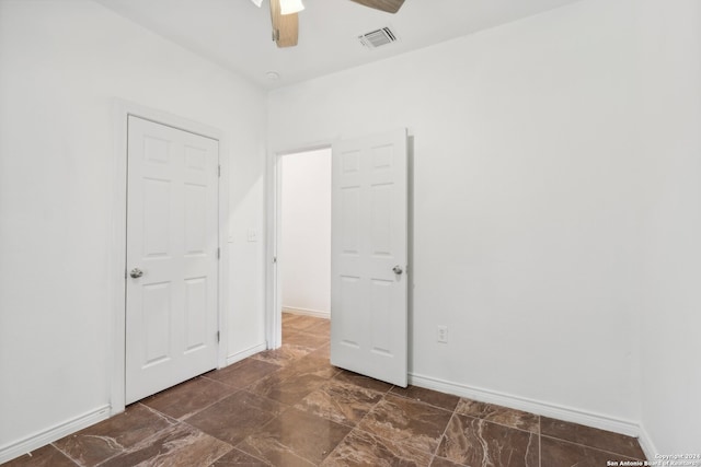 spare room featuring ceiling fan