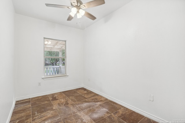 unfurnished room with ceiling fan