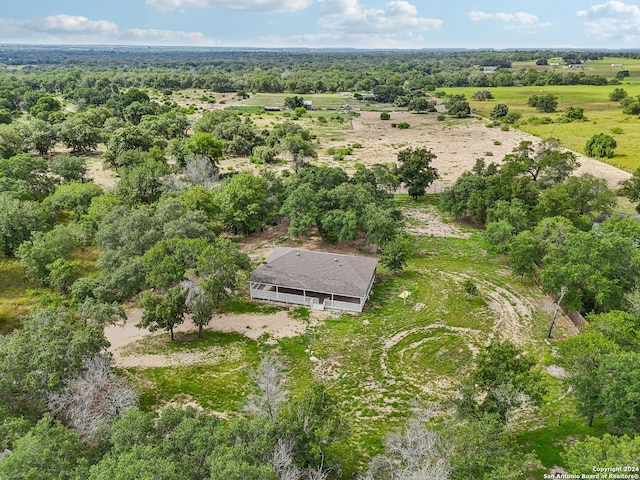 birds eye view of property with a rural view