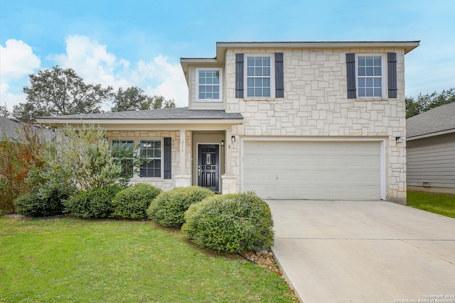 view of front facade with a front lawn and a garage