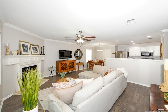 living room with ceiling fan, dark hardwood / wood-style floors, and ornamental molding