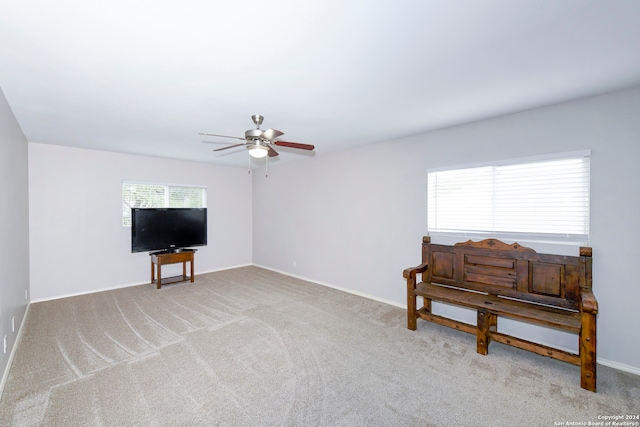 miscellaneous room with light carpet and ceiling fan