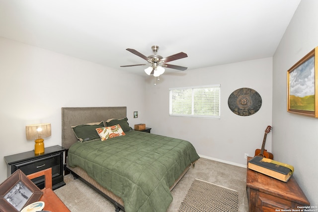 bedroom featuring light carpet and ceiling fan