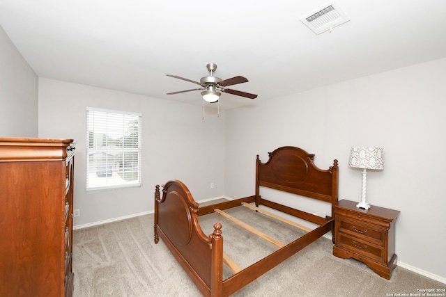 bedroom with light carpet and ceiling fan