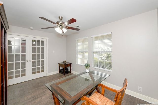 dining room with ceiling fan, dark hardwood / wood-style flooring, and french doors