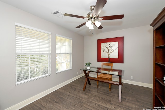 office space featuring dark hardwood / wood-style flooring and ceiling fan