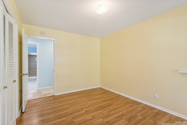 unfurnished room featuring light hardwood / wood-style flooring