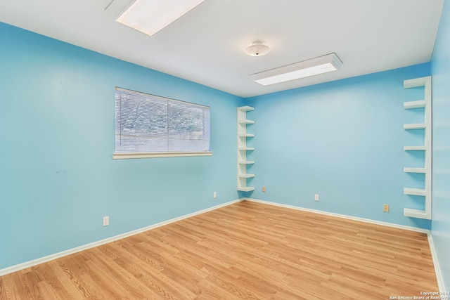 spare room with light wood-type flooring