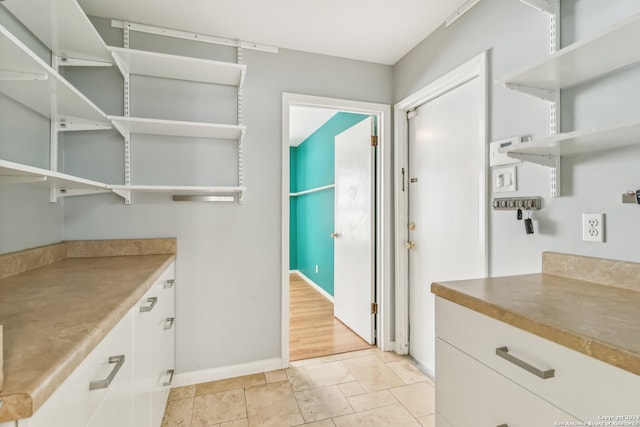 kitchen featuring white cabinets and light hardwood / wood-style floors