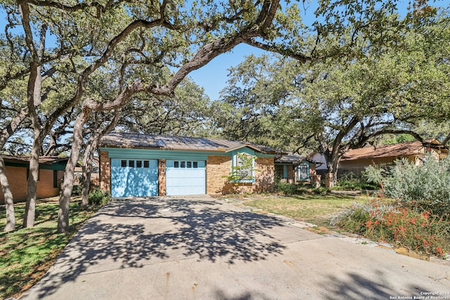 single story home with a garage