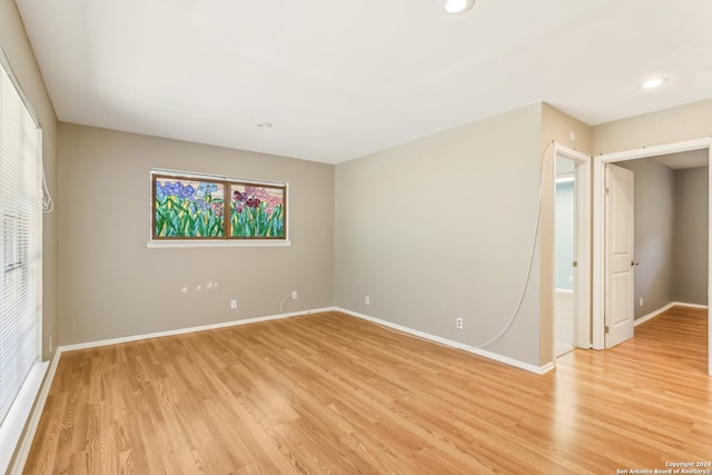 spare room featuring light hardwood / wood-style flooring