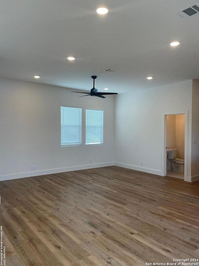 spare room featuring ceiling fan and hardwood / wood-style flooring