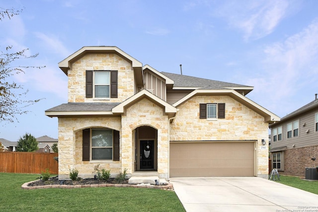 view of front facade with a front yard and a garage