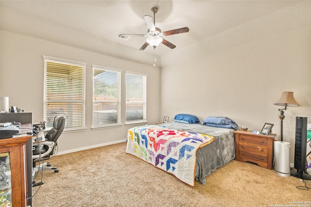 bedroom featuring light colored carpet and ceiling fan