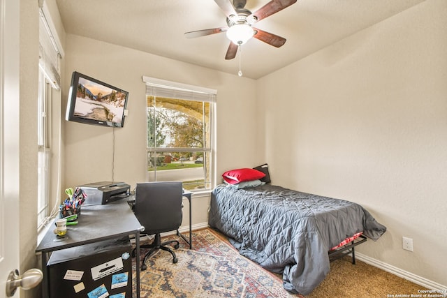 carpeted bedroom with ceiling fan