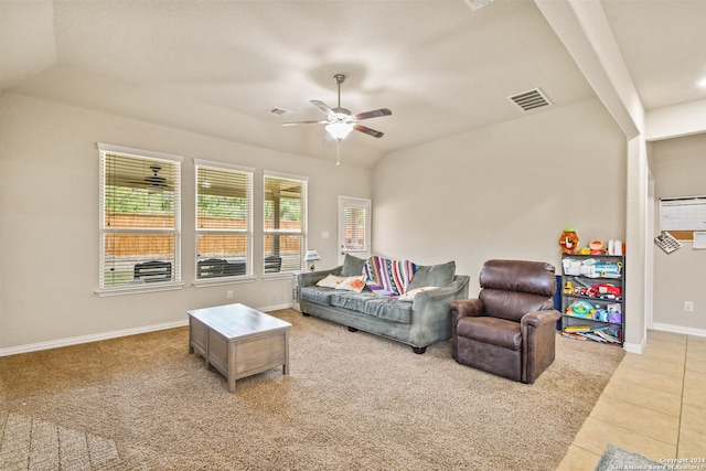 living room with ceiling fan and light colored carpet