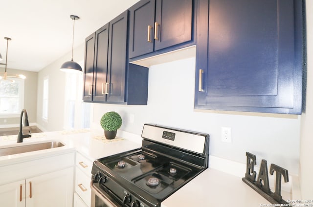 kitchen featuring blue cabinetry, white cabinets, black range oven, and sink