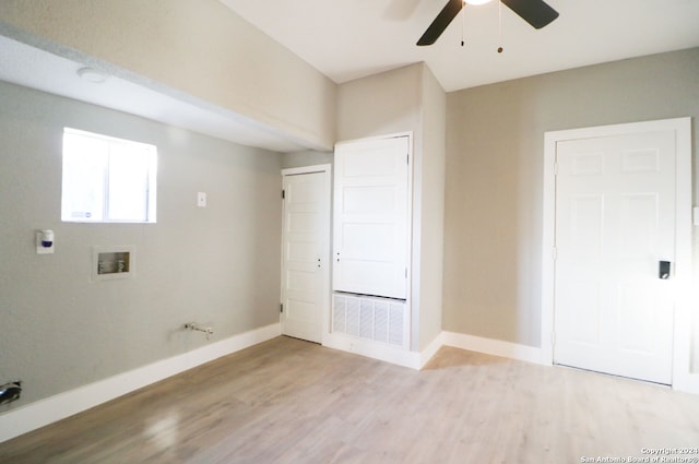 washroom featuring ceiling fan, hookup for a washing machine, and light hardwood / wood-style floors