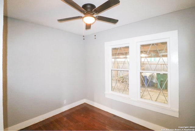 empty room featuring hardwood / wood-style flooring and ceiling fan