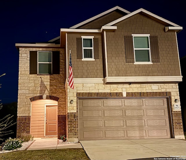 view of front of property featuring a garage