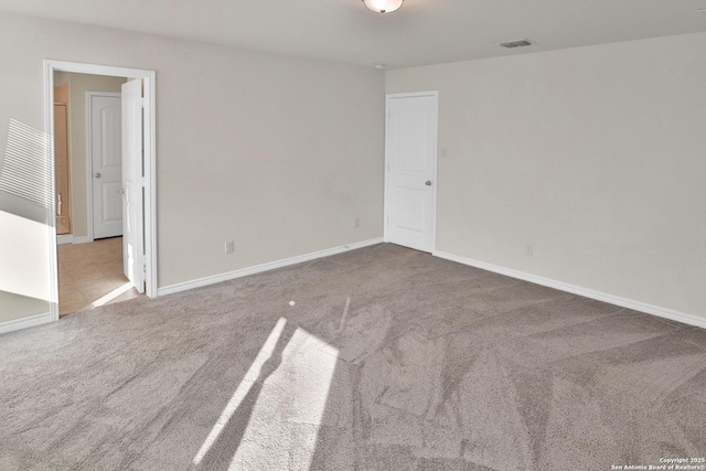 spare room with light carpet