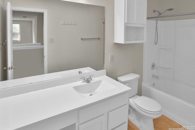 full bathroom featuring vanity, toilet, and washtub / shower combination