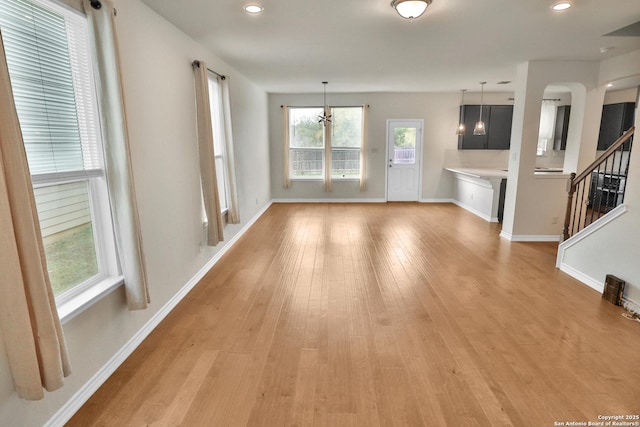 unfurnished living room featuring light hardwood / wood-style floors