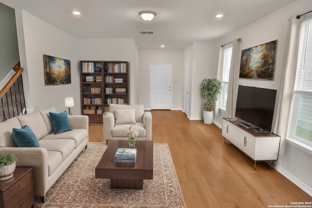 living room with light hardwood / wood-style flooring