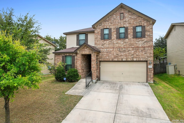 view of front facade with a front yard and a garage