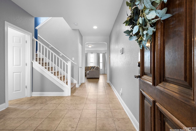 entrance foyer featuring light tile patterned flooring