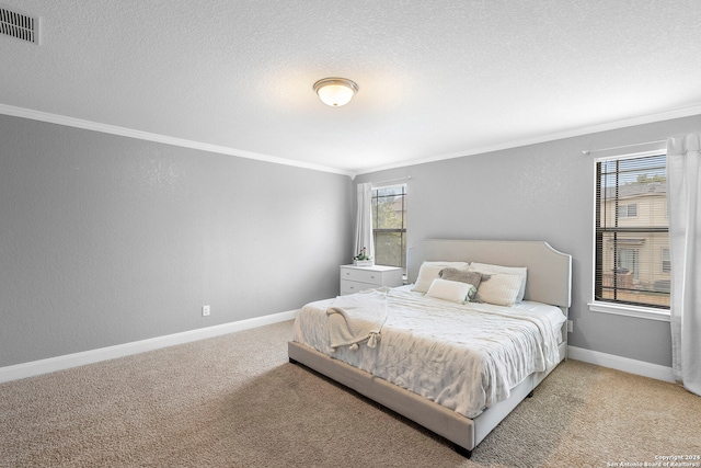 bedroom featuring carpet, multiple windows, and ornamental molding