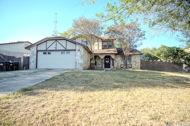 view of front facade with a front yard and a garage