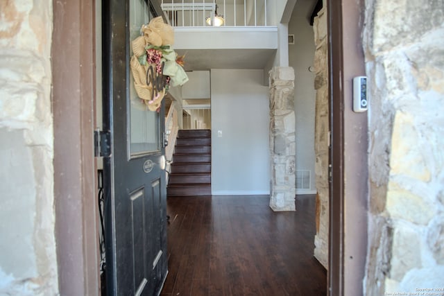 foyer with dark hardwood / wood-style floors