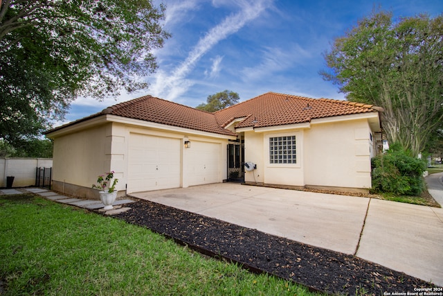 back of house with a garage